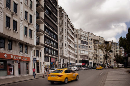 View of cars in blurry motion and buildings in Nisantasi / Istanbul that is a popular shopping and residential district.のeditorial素材