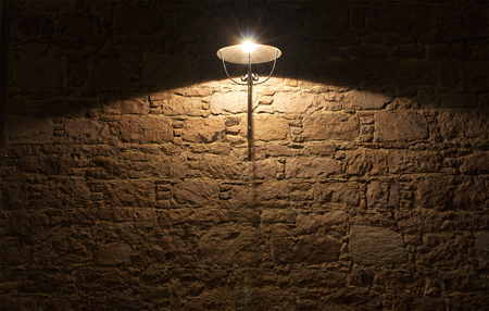 Night view of decorative street ligtht and stone wall.の写真素材