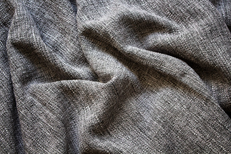 Close up view of crumpled, grey wool fabric background.の写真素材