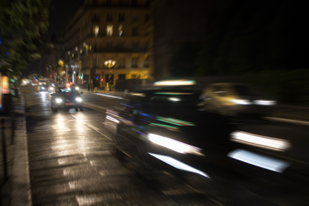 Blurry motion image of cars in traffic at night in Paris. Speed concept.の写真素材