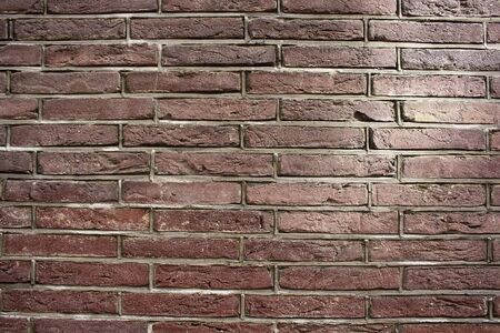 Close up view of red / brown brick wall.