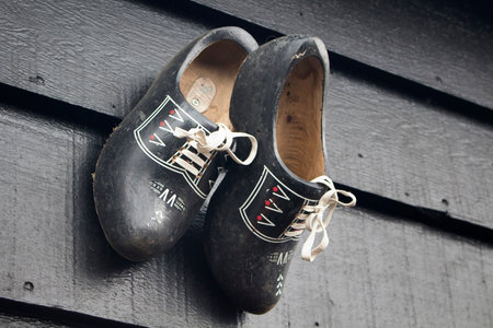 Close up view of traditional wooden Dutch shoes in Zaanse Schans, neighborhood in the Dutch town of...