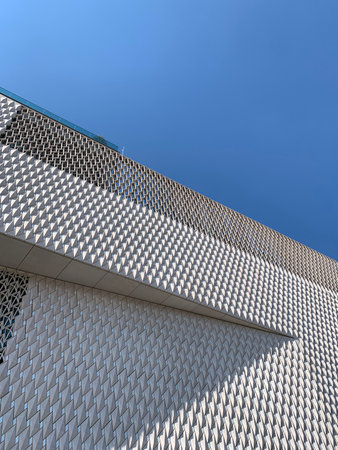 Bottom view of newly opened contemporary art museum in Istanbul with clear blue sky background. It...