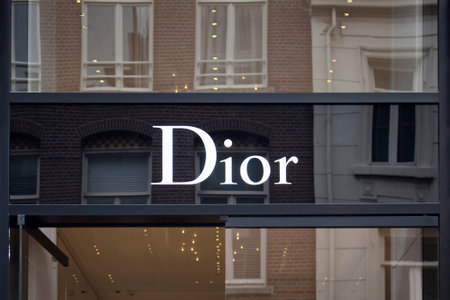 View of signage of French fashion goods manufacturer's store on on luxury shopping street named "Pieter Corneliszoon Hooft" in Amsterdam. It is a summer day.のeditorial素材
