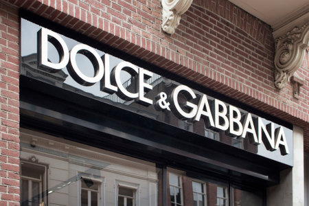 View of signage of Italian fashion goods manufacturer's store on on luxury shopping street named "Pieter Corneliszoon Hooft" in Amsterdam. It is a summer day.のeditorial素材