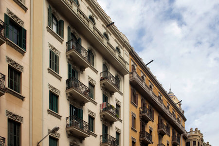 View of historical, traditional, typical buildings showing Spanish / Catalan architectural style in Barcelona. It is a summer day.のeditorial素材