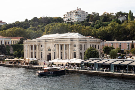 View of people at a cafe by Bosphorus in Ortakoy area of European side of Istanbul. It is a sunny summer day. Beautiful scene.のeditorial素材