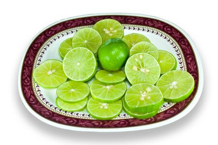 Lime green is cut into pieces, place on plate.の写真素材
