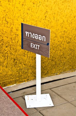 Exit signs  Mounted on white steel poles の写真素材