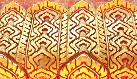 Wall sculpture of the temple in Thailand の写真素材