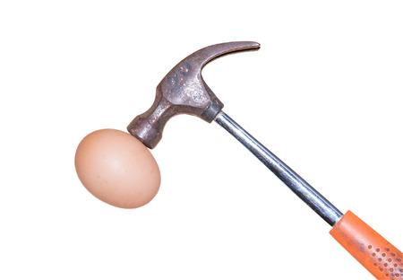 Hammer hit to the eggs isolated on white backgroundの写真素材