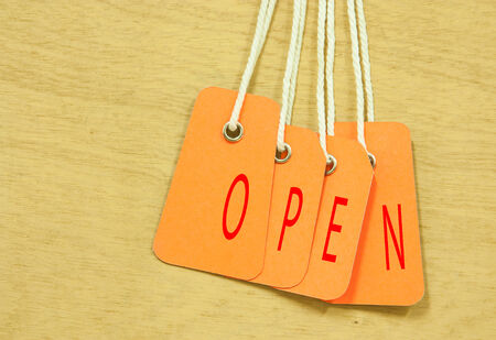 Open icon tag on background of plywood.の写真素材