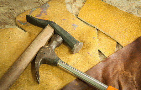 hammer tools on  leather  background