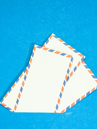 Three Air mail envelope interpolate on blue background.