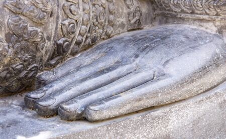 hand of buddha statue in antique asiaの写真素材