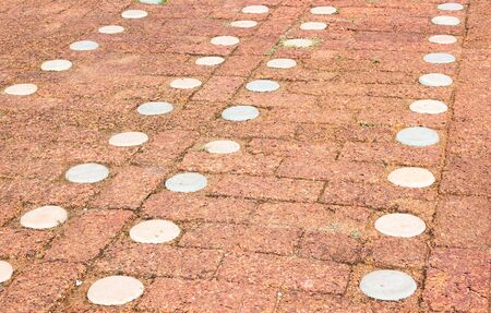The floor is concrete red block, have White stripesの写真素材