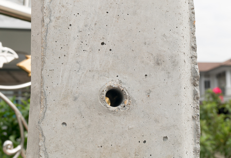 The Cement pole hole background and yellow line ,Texture cement poleの写真素材