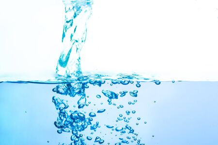 Blue waterways flowing with white background bubblesの写真素材