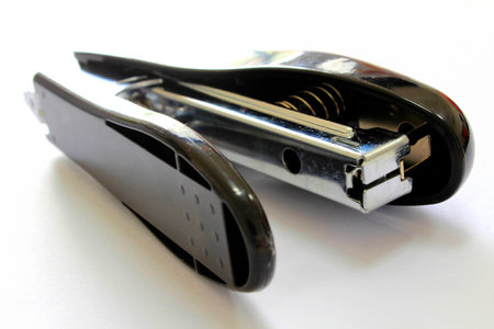 Grey office stapler isolated on white background with clipping path