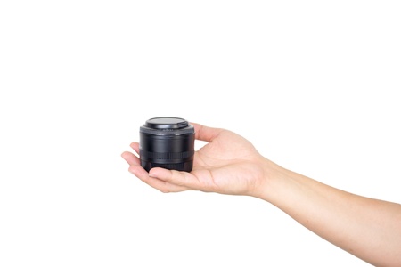 lens in hand on white backgroundの写真素材