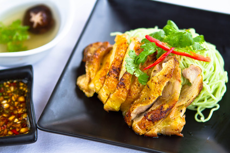 Roasted Duck nooddle on black plateの写真素材