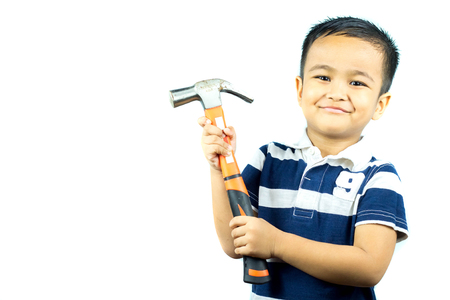 asian boy  holding hammer and smiling on white backgroundの写真素材