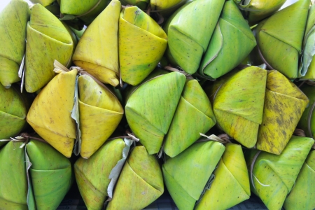 Thai style dessert, made from banana and glutinous rice, wrap with banana leafの写真素材