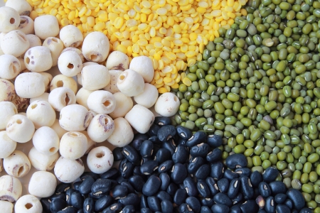 Heap of four grains including mung soybean dried lotus seeds and  black peas の写真素材