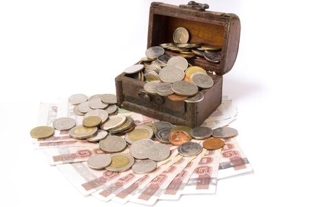 Wooden chest of money, isolated over white backgroundの写真素材