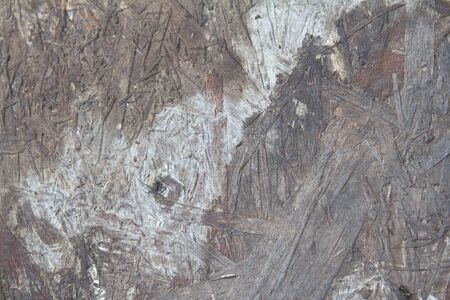 Weathered obsolete rough textured old plywood backgroundの写真素材