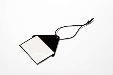 Blank price tag black on white background with soft shadow