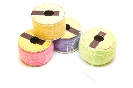 stack of coloured sewing thread