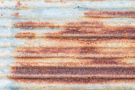 background of old galvanized iron sheet have red rustの写真素材