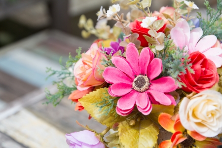 colorful flowers pots decoration on wooden tableの写真素材