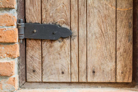 Wooden wall with doors locked.