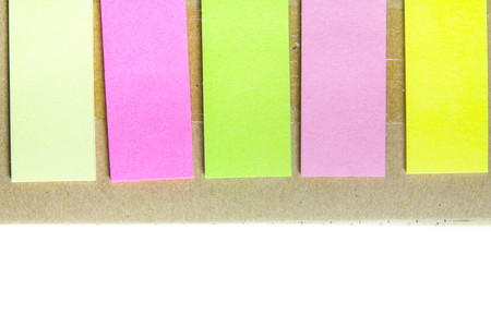 Spiral notebook and post-it on white backgrounds