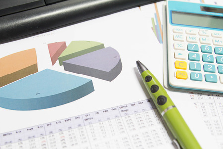 financial charts and graphs on the tableの写真素材