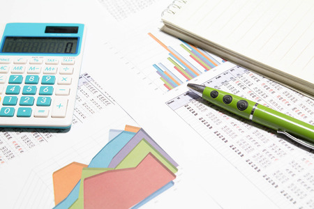 financial charts and graphs on the tableの写真素材