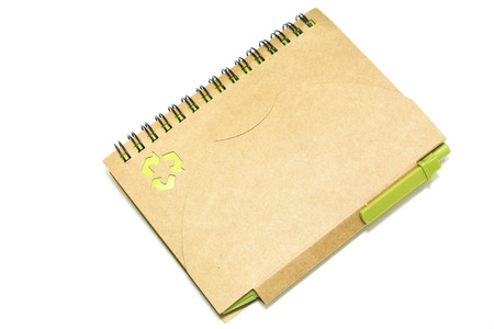 recycle notebook and a pen on white backgroundの写真素材