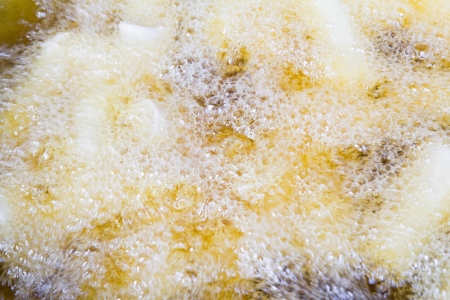 spring rolls in boiling oilの写真素材