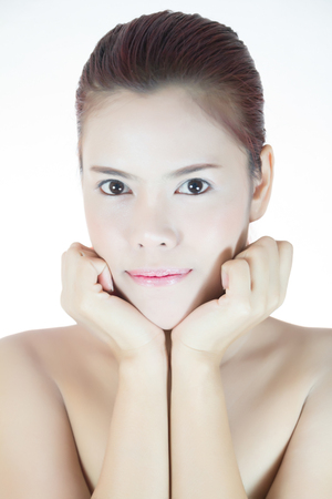 Portrait of a beautiful asian female model on white backgroundの写真素材