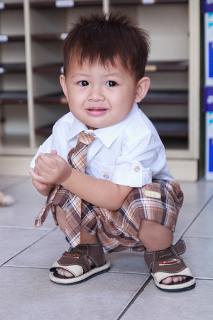 The little boy in business suite having a happiness actionの写真素材