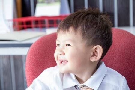 The little boy in business suite having a happiness action