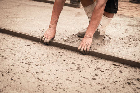 Concrete pouring during commercial concreting floors of buildings in constructionの写真素材