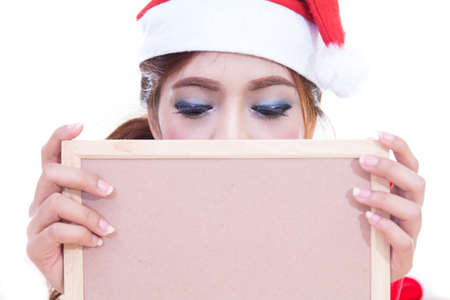 Beautiful women asian hold wood board in red santa dress. christmas conceptの写真素材