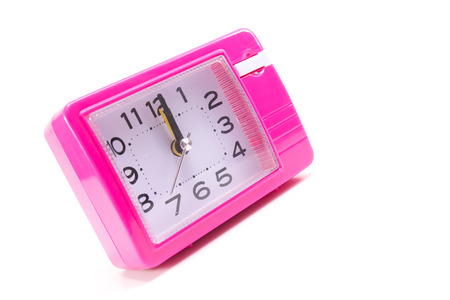 Pink alarm clock isolated on white backgroundの写真素材