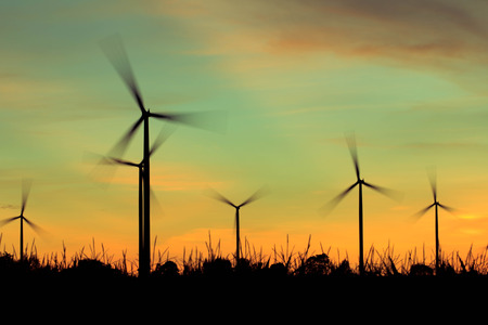 Wind turbine power generator at twilight sunsetの写真素材