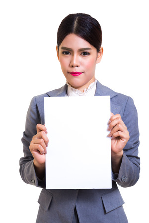 Business woman standing behind a blank board on white backgroundの写真素材