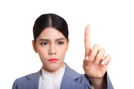Business woman pointing her finger on imaginery virtual buttonの写真素材