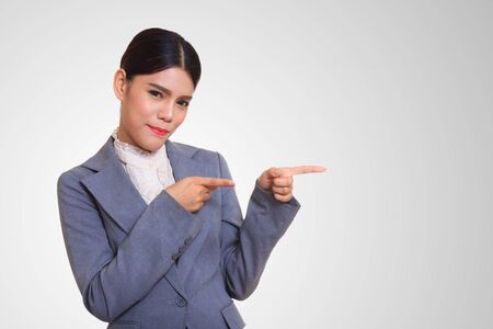Business women smiling and pointing at something interesting.の写真素材